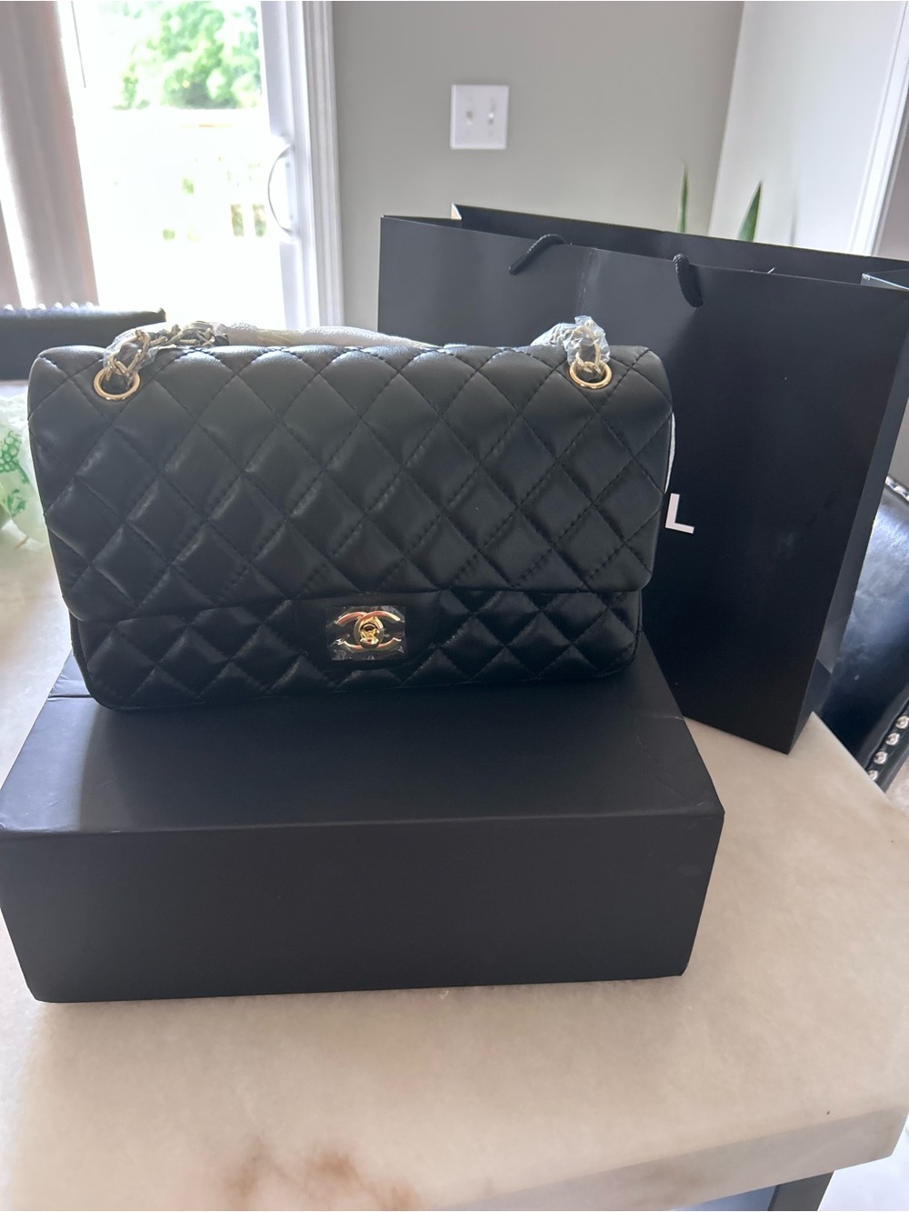 CHANEL Black Quilted Leather Shoulder Bag with Gold Hardware